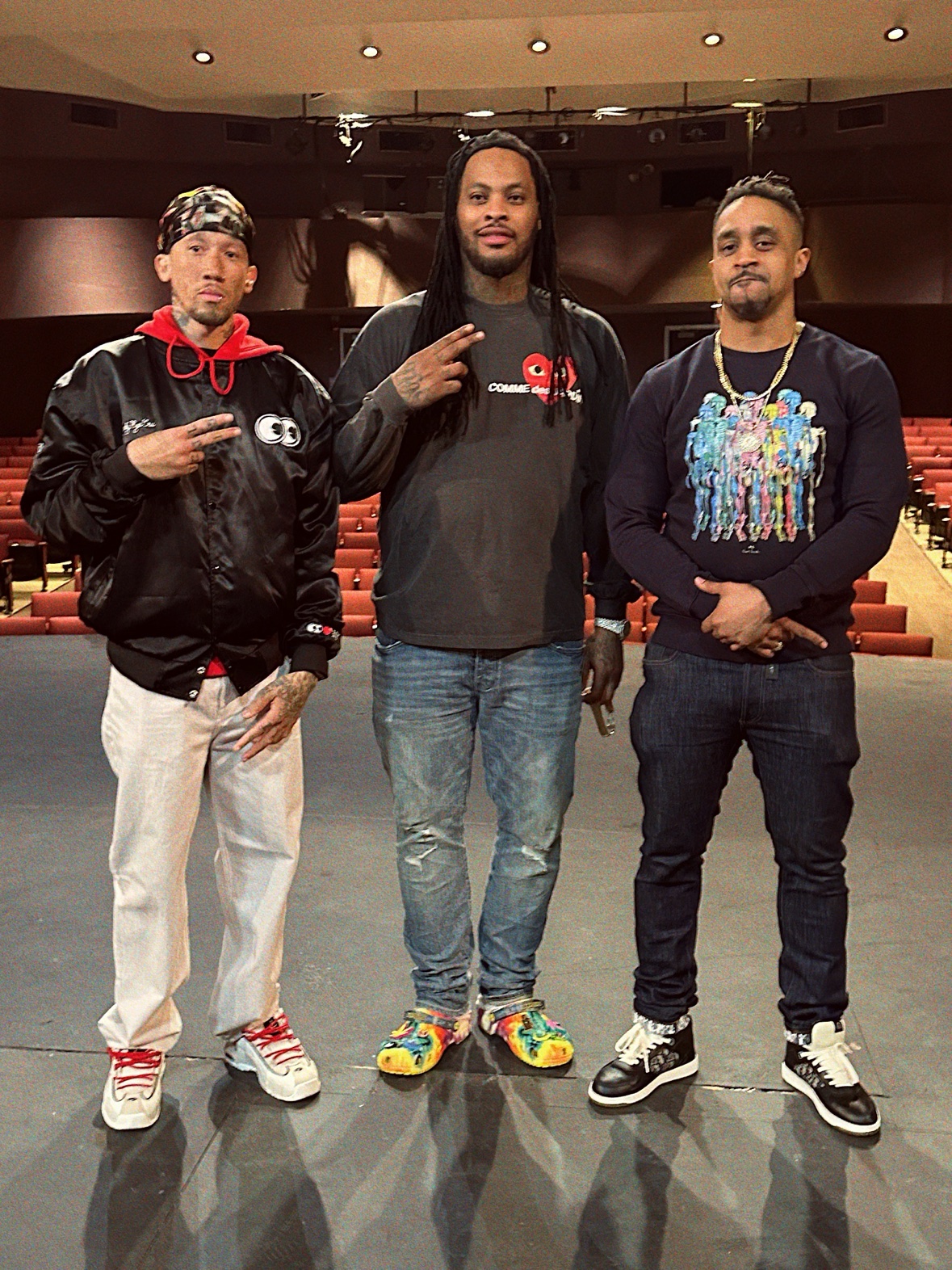 Waka Flocka and DJ Takeova together on a theater stage