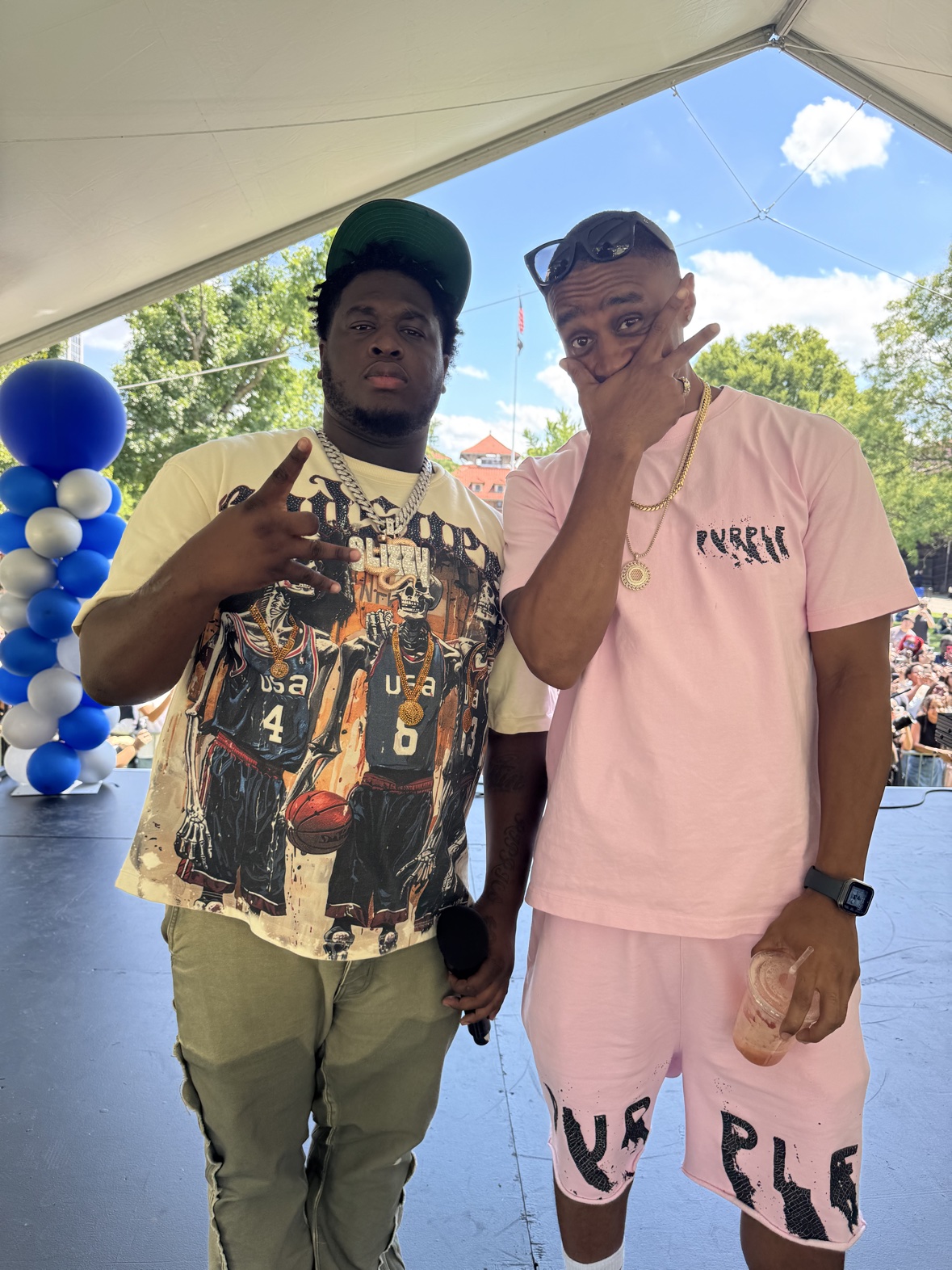 Cash Cobain and DJ Takeova together on an outdoor stage