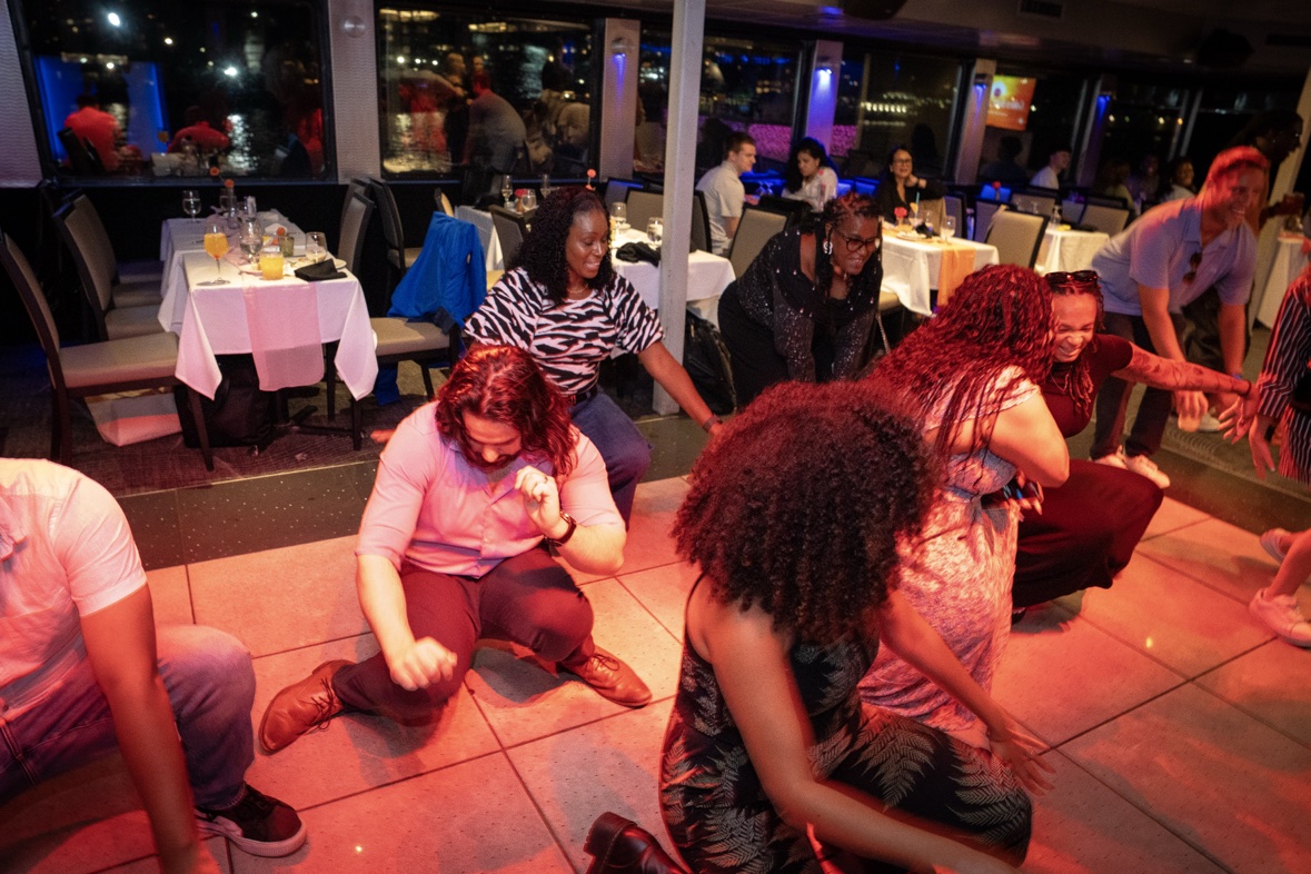 Guests dancing at a corporate boat party