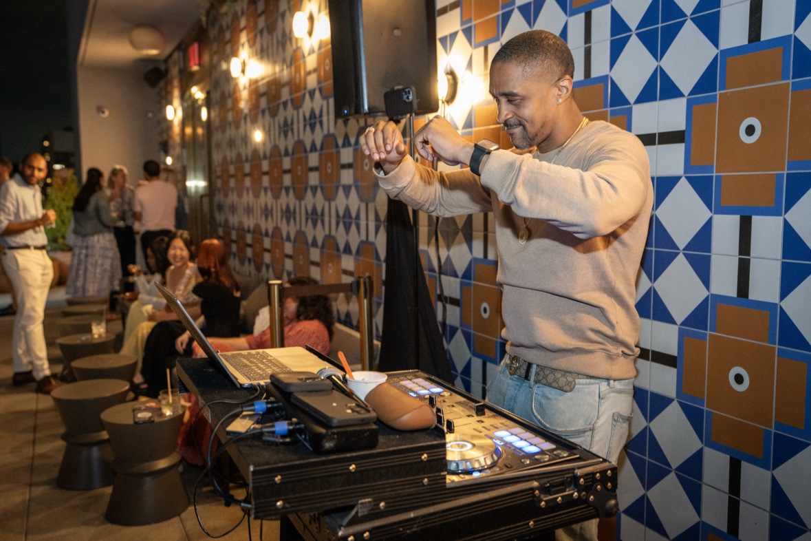 DJ Takeova performing a rooftop DJ set