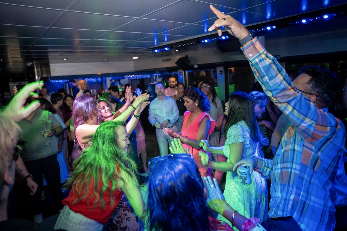 Guests dancing together on the yacht party dance floor